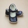 Toddler Girls Black Leather Ruffle Mary Janes - Toddler - Petit Foot.com